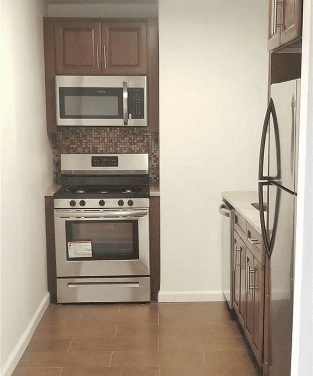 Factory-smooth kitchen cabinet finish in a luxury residential setting.